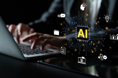 AI vor schwarzem Hintergrund, © AdobeStock_1881108428InfiniteFlow